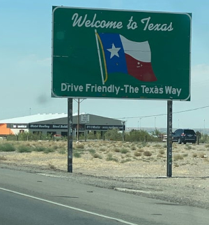 Highway sign saying 'Welcome to Texas.'